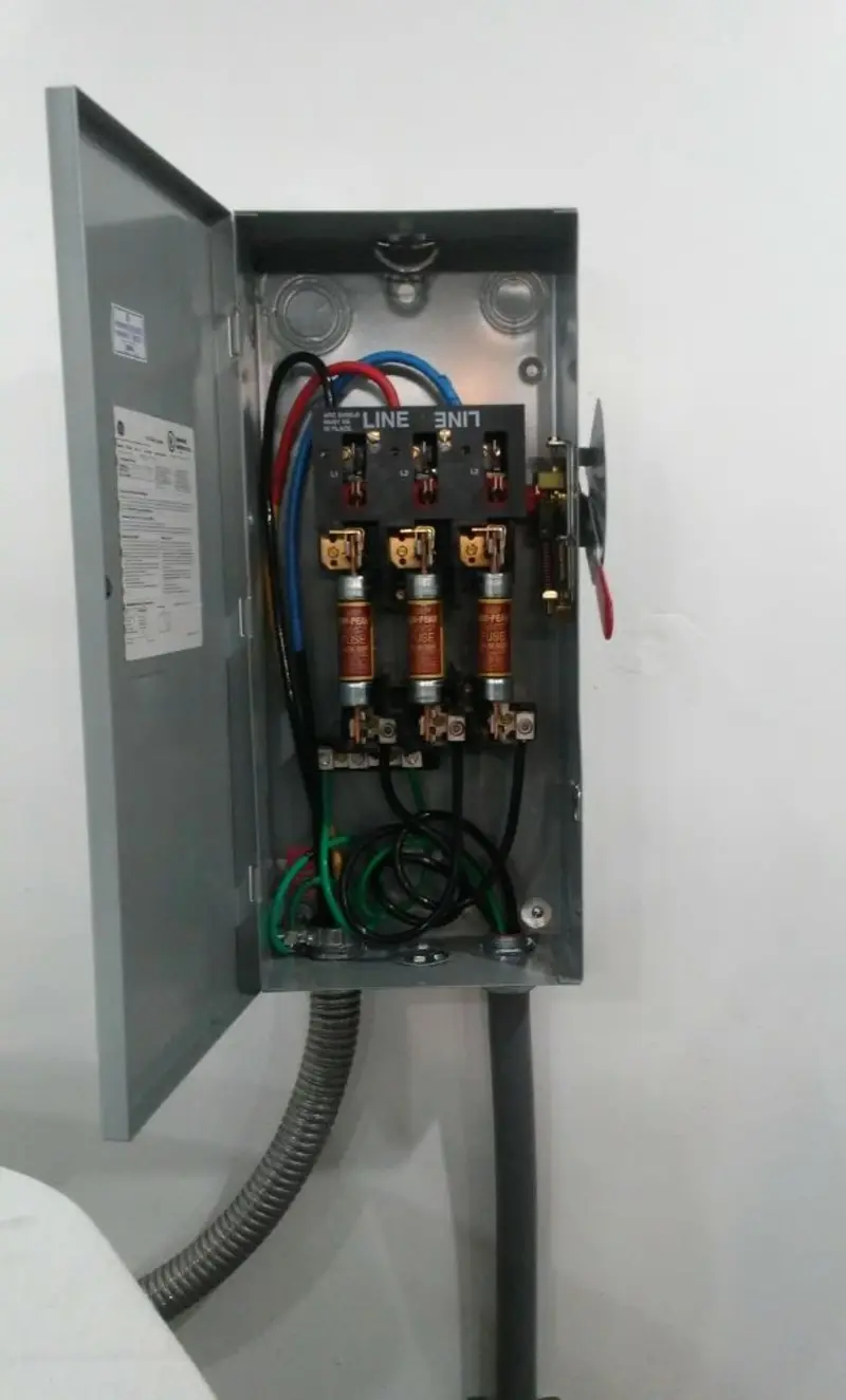 Three-phase disconnect switch installed for Smoke Detector Installation in Sutton